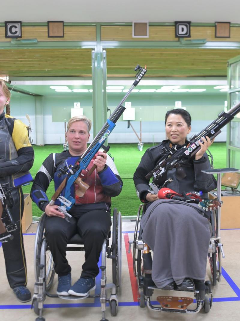 Medallists strike a pose after the end of the R2- women's 10m air rifle SH2 in Al Ain. 