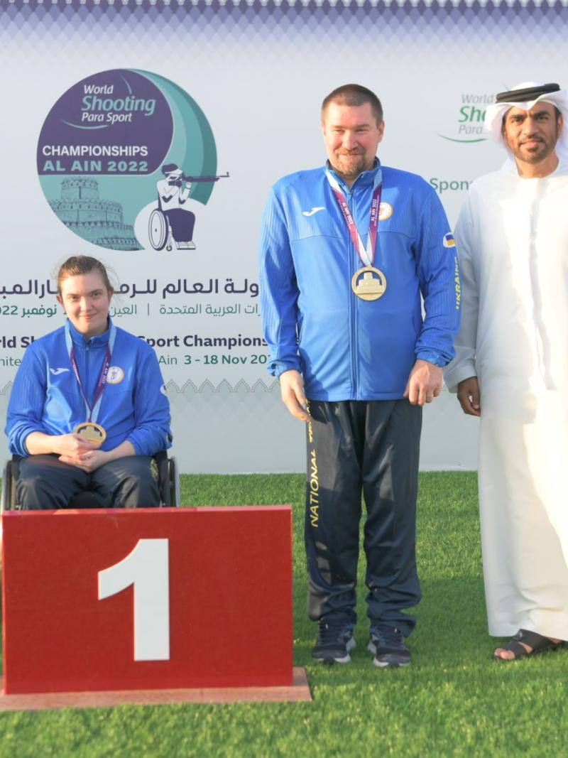 Ukraine's Vasyl Kovalchuk and Anastasiia Telizhenko pose with their gold medals at Al Ain 2022.