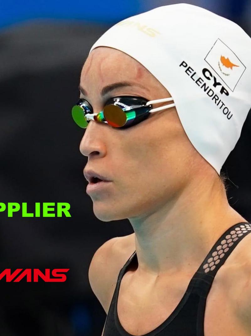 A female swimmer with a white cap and black swimsuit next to the Manchester 2023 and Swans logos