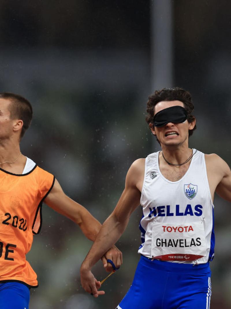 Greece's Athanasios Ghavelas celebrates with his guide Sotirios Gkaragkanis after winning gold in the men’s 100m T11 at the Tokyo 2020 Paralympic Games.