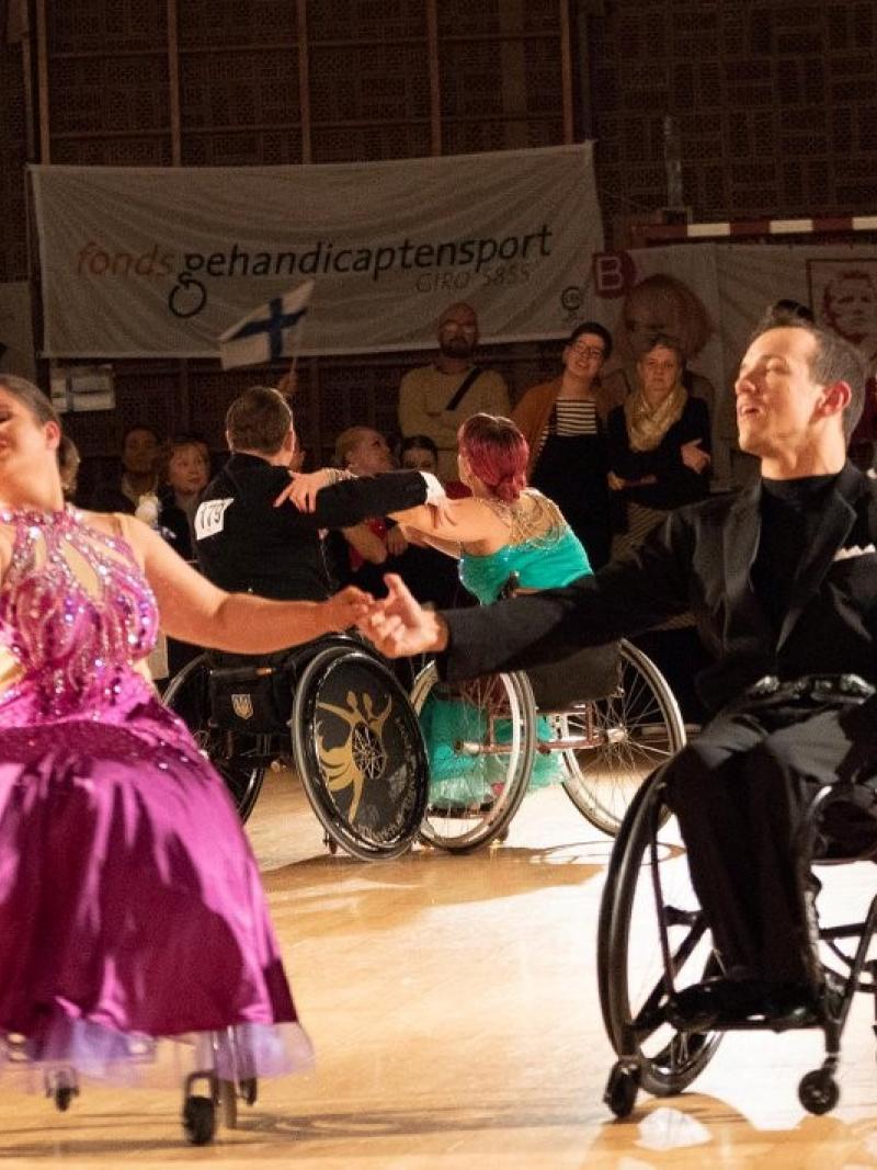 A female and a male wheelchair dancers in a Para dance sport competition