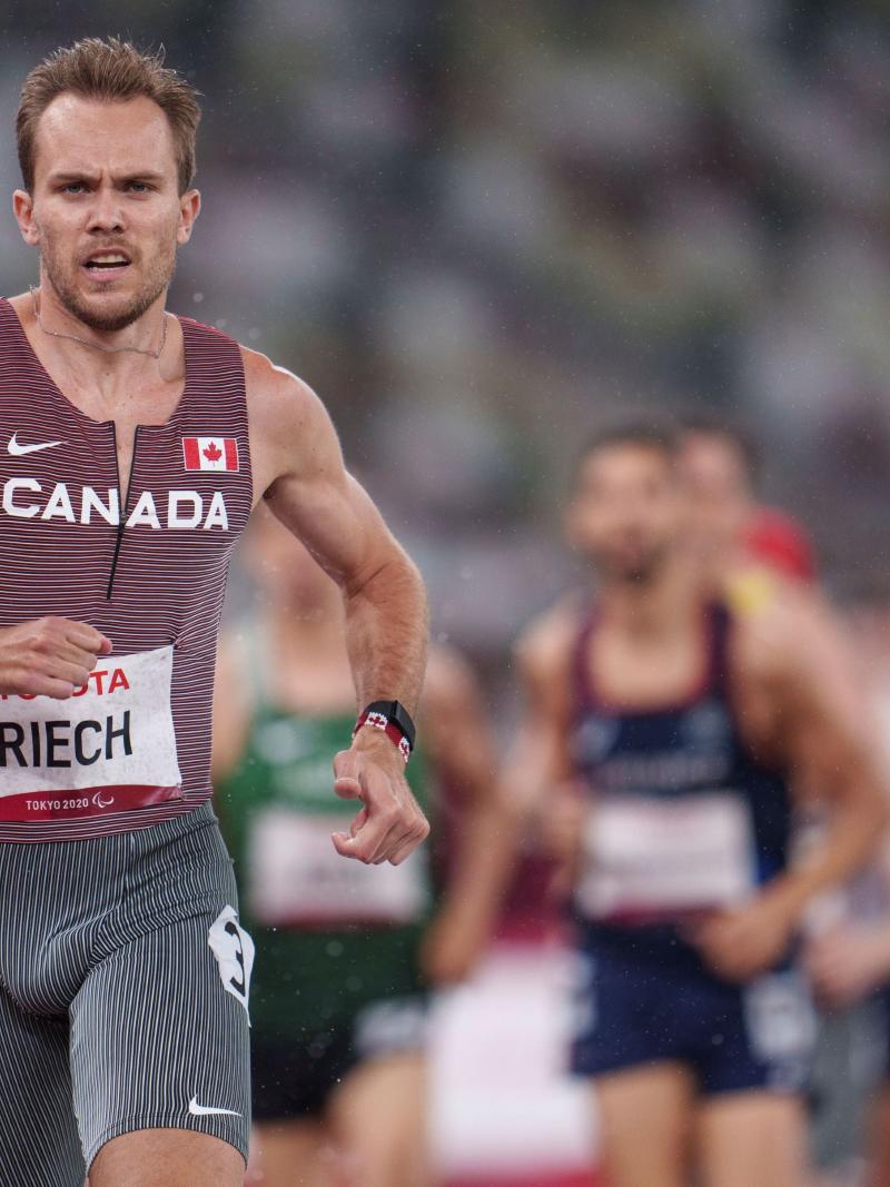 A close-up image of a male runner competing at Tokyo 2020.