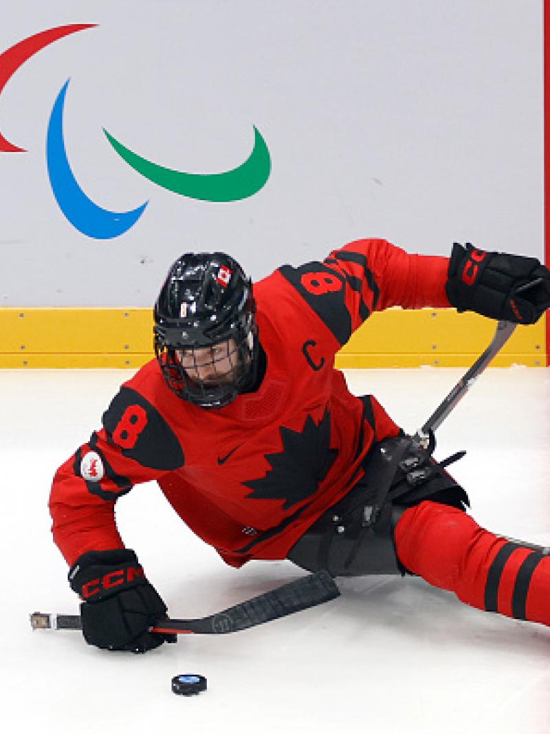 Tyler McGregor of Team Canada controls the puck