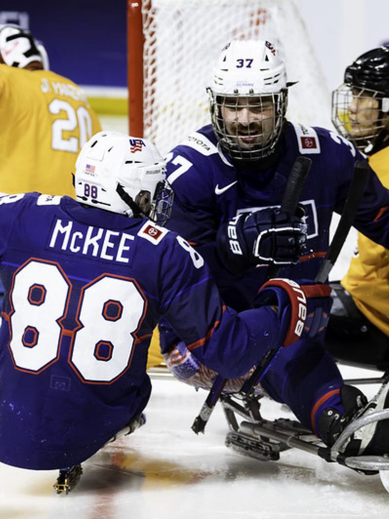 Two USA Para ice hockey players celebrating 