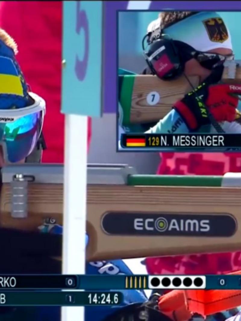 A screen showing two Para biathlon athletes shooting with their rifles during a competition
