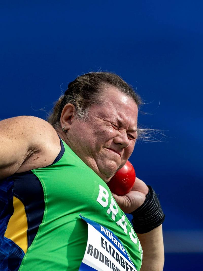 A female Para athlete competing in the shot put