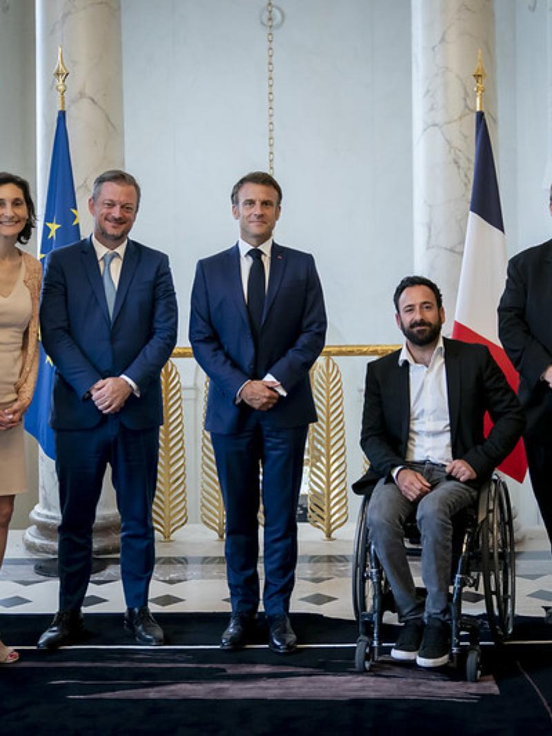 Seven people pose for a group photo