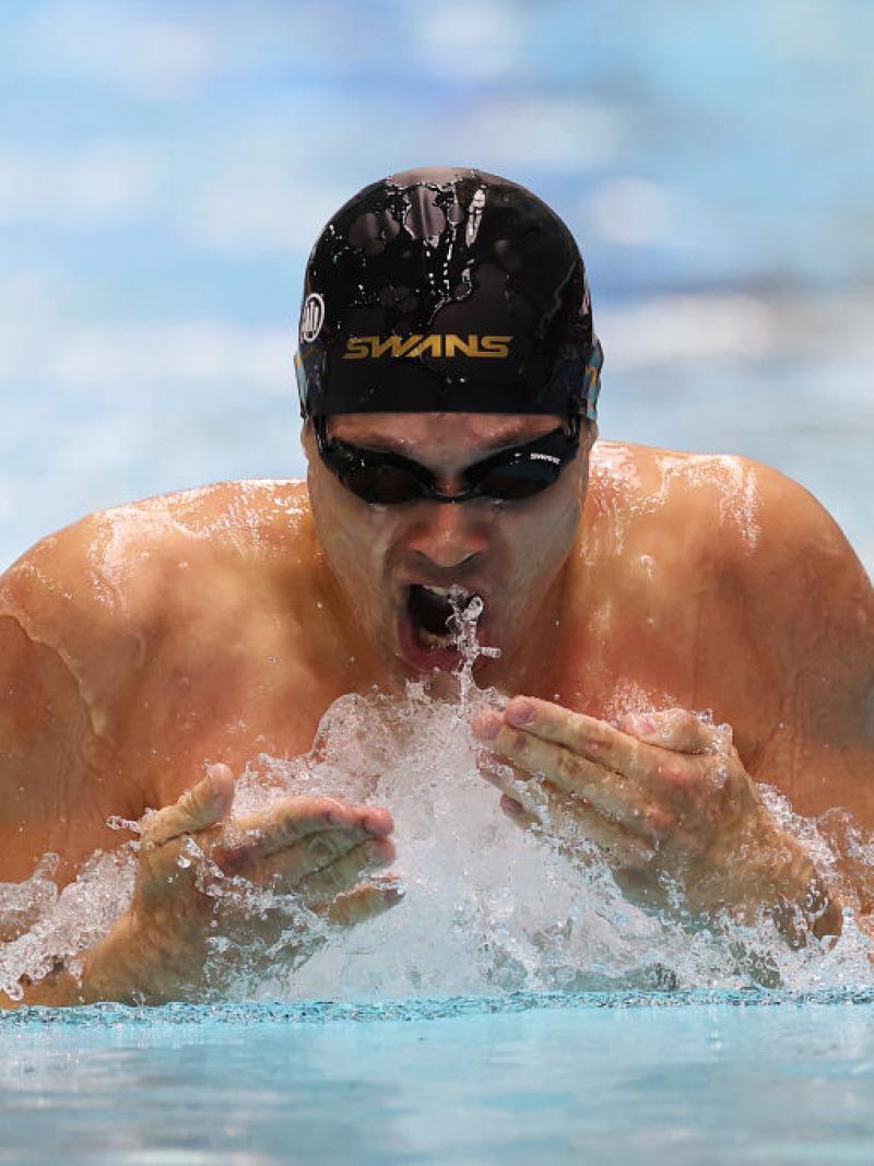 A male athlete swimming breaststroke