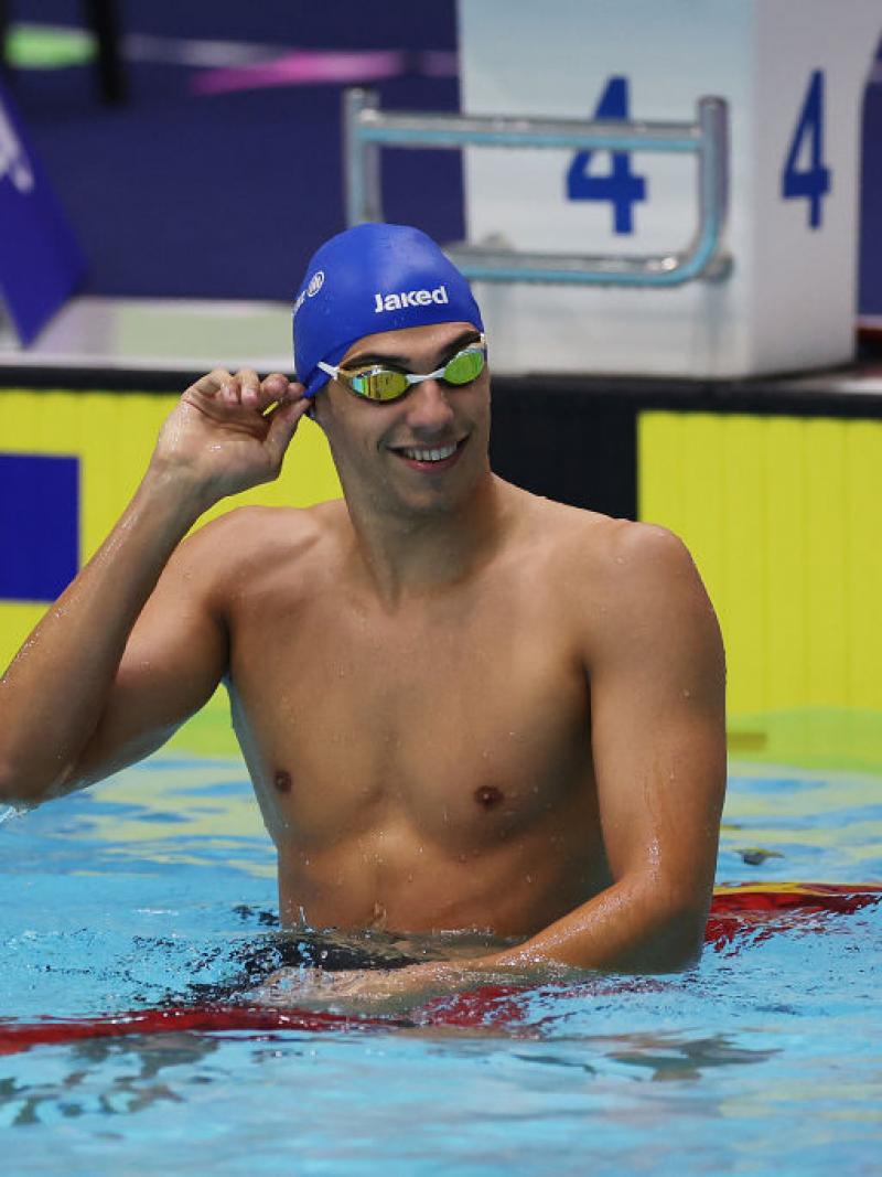 A male swimmer on a lane in the pool