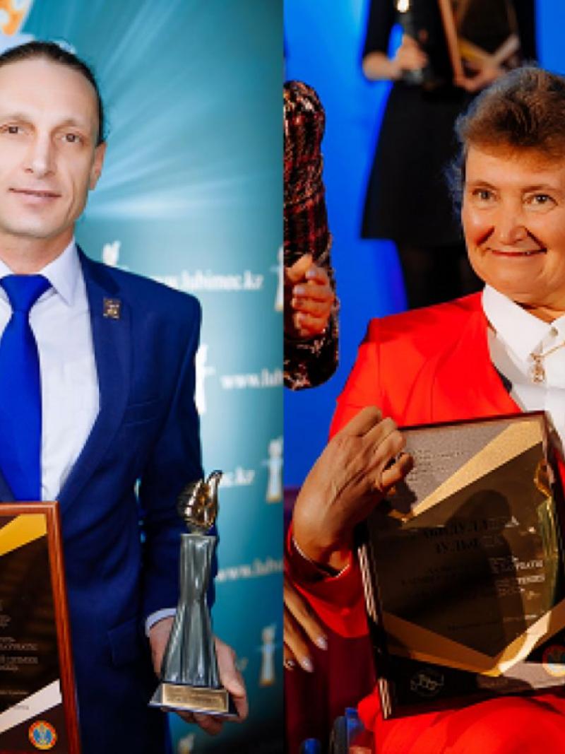 A man and a woman in a wheelchair holding trophies