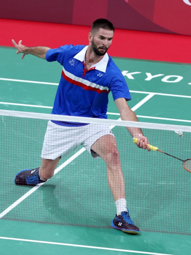 A male Para badminton player competes