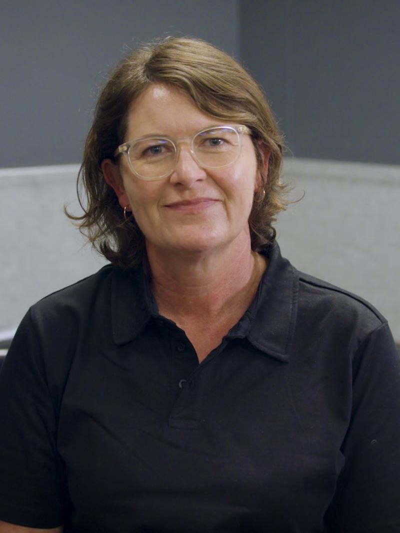A woman smiling in an office 
