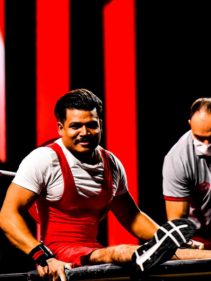 A Powerlifter in a bench after a successful lift.