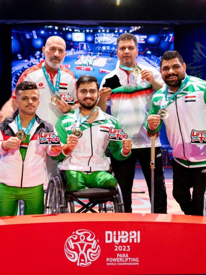 A group of five men on the podium of the Dubai 2023 Para Powerlifting World Championships