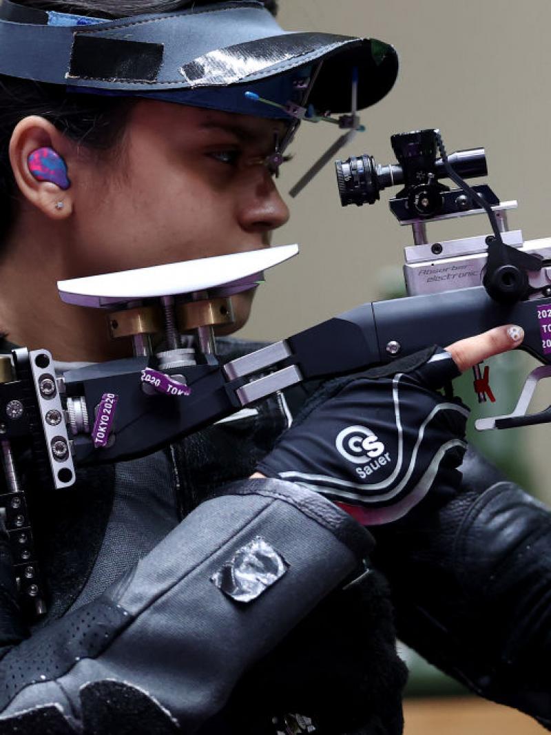 A female rifle shooter in a competition