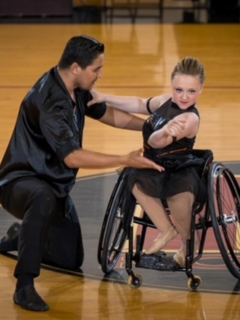 A female wheelchair dancer with a standing male partner