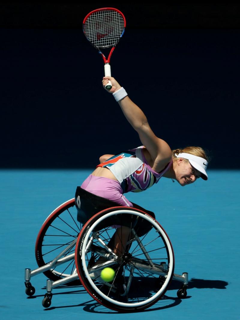 A female athlete plays a backhand in the women's singles final at the Australian Open.