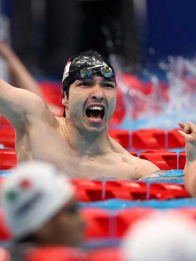 A male swimmer celebrates after touching the wall at the Tokyo 2020 Paralympics.