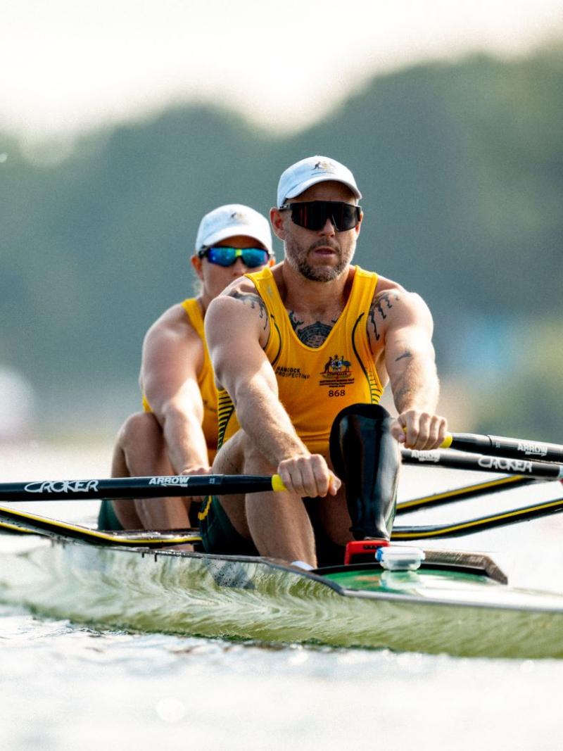 Two Para rowers - a male athlete and a female athlete - compete.