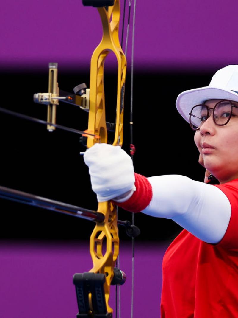 Para archer Chen Minyi aims her bow and arrow ready to shoot 