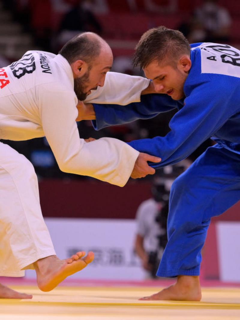 Two males judokas in action at Tokyo 2020. 