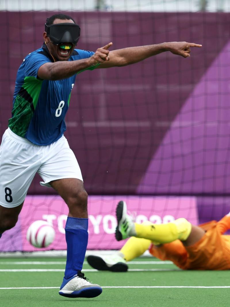 Raimundo 'Nonato' Mendes, a male blind football player from Brazil, celebrates after scoring a goal at the Tokyo 2020 Paralympics.