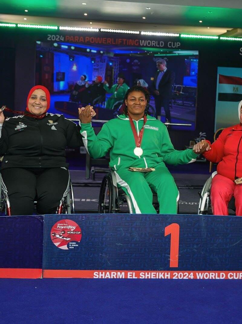 Athletes strike a pose on the podium 
