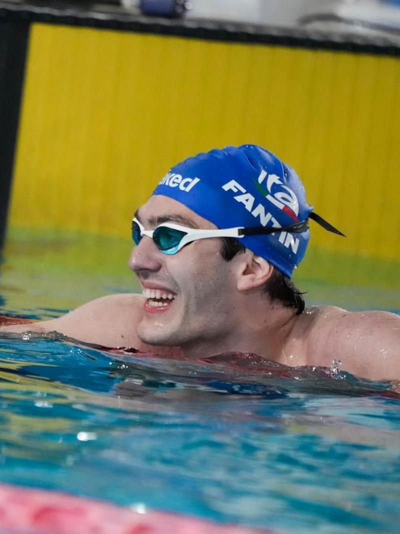 A swimmer celebrates after a race.