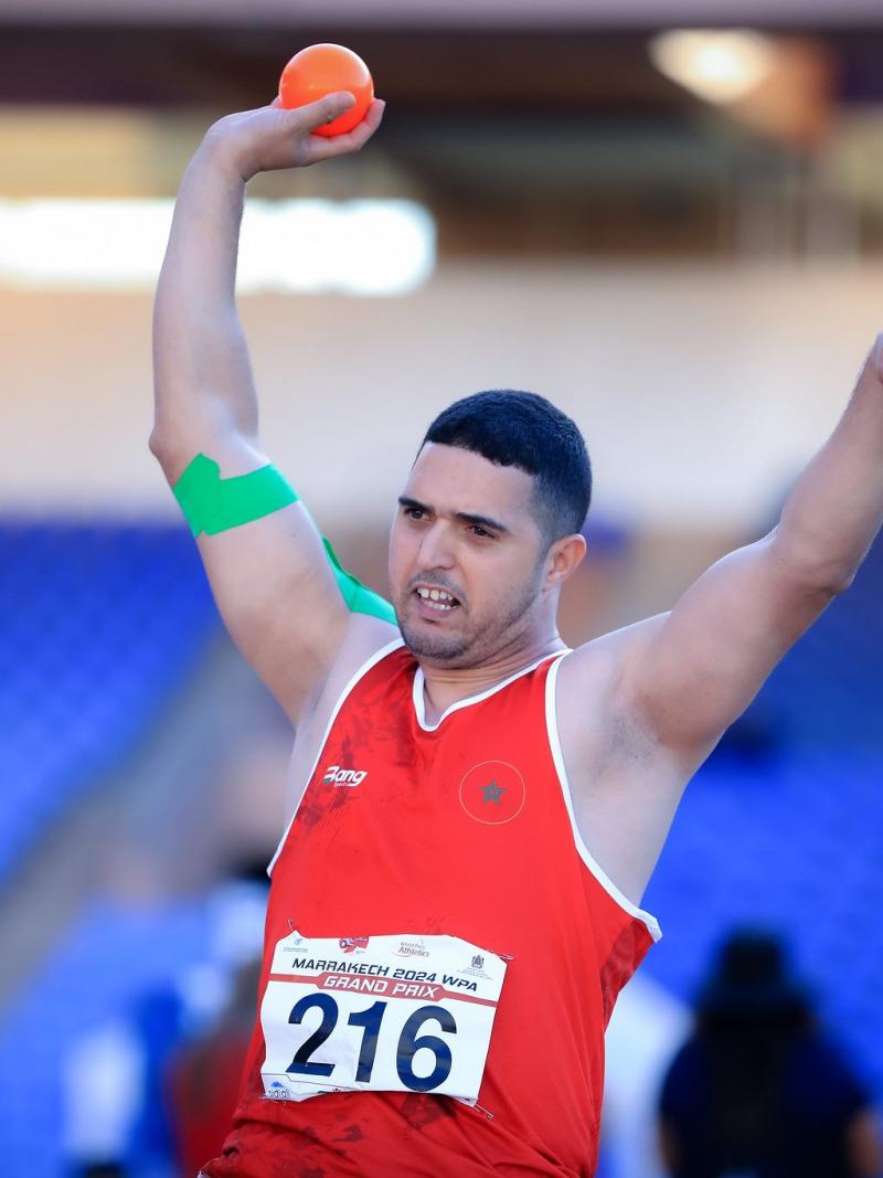 A shot putter in action