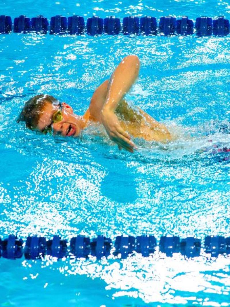 A male swimmer in a competition