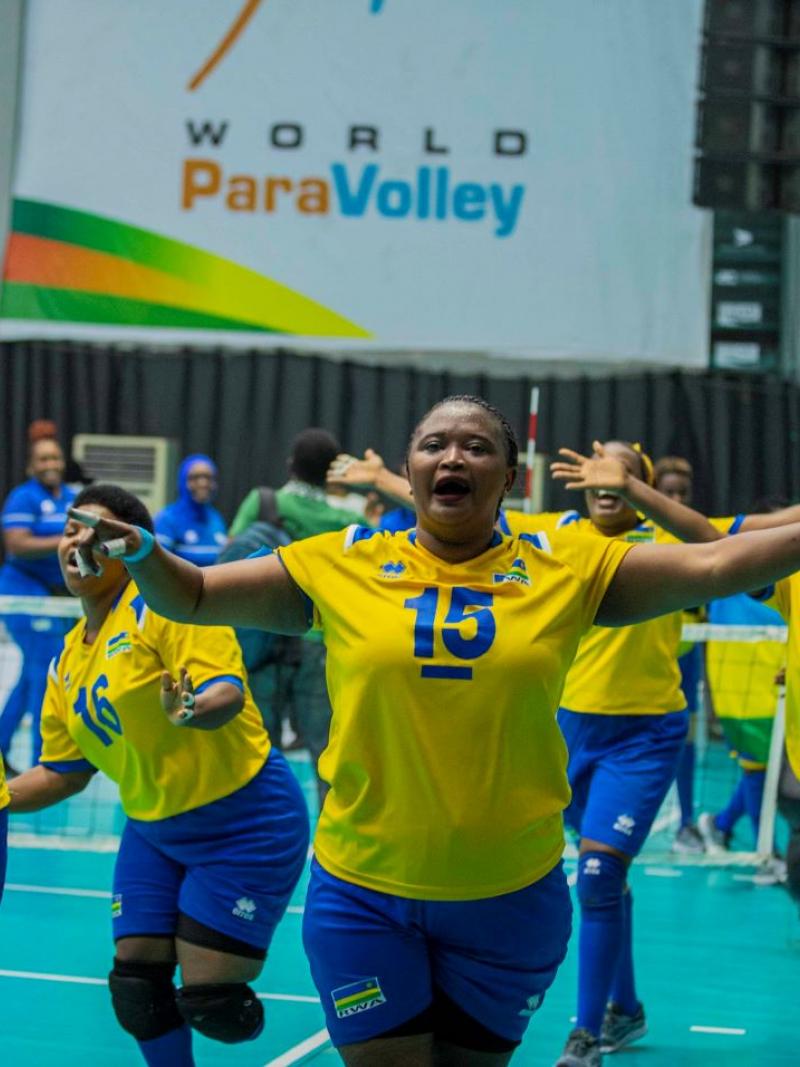 Female sitting volleyball athletes celebrating