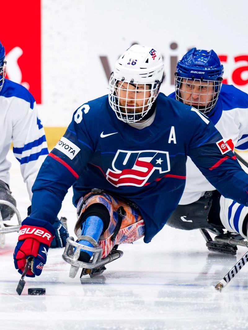 Para Ice hockey players in action.
