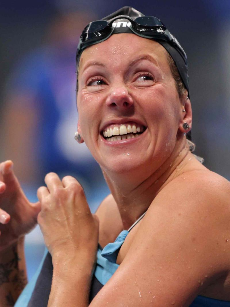 A swimmer reacts after a race
