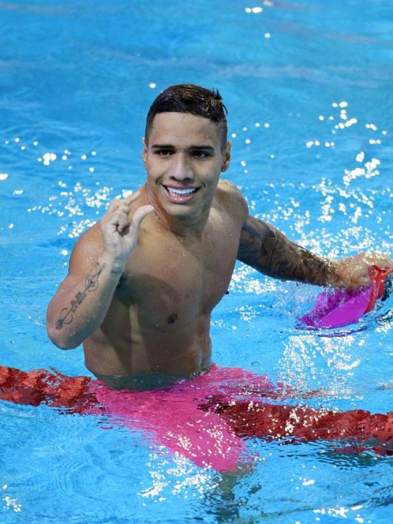 A male Para swimmer competes 