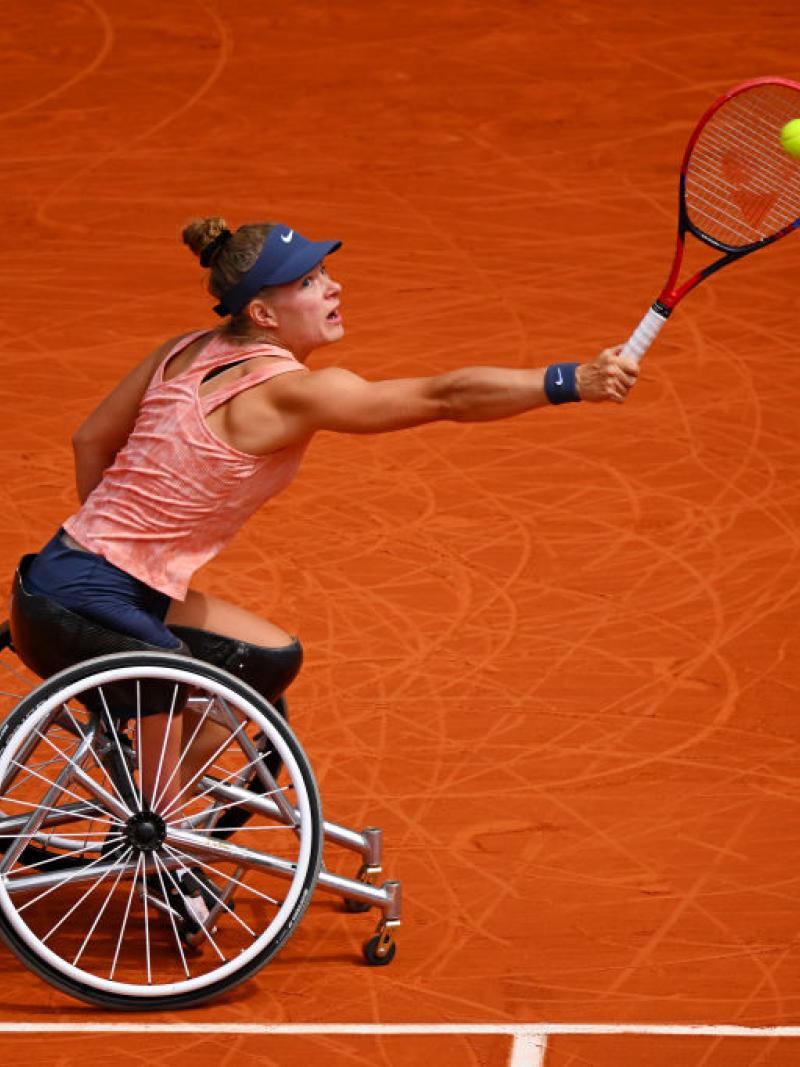 A female wheelchair tennis athlete in action at the French Open