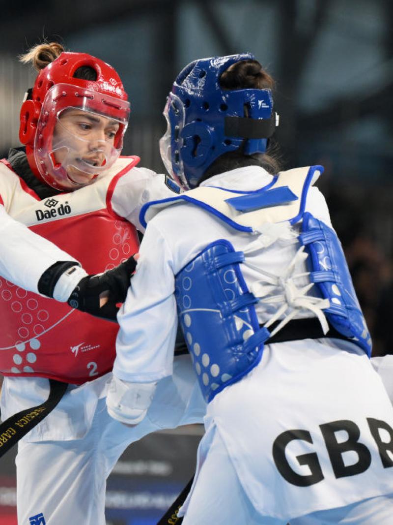 Two female Para taekwondo athletes in action
