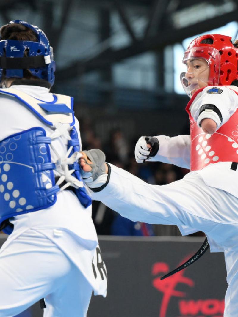 Two female Para taekwondo athletes in action