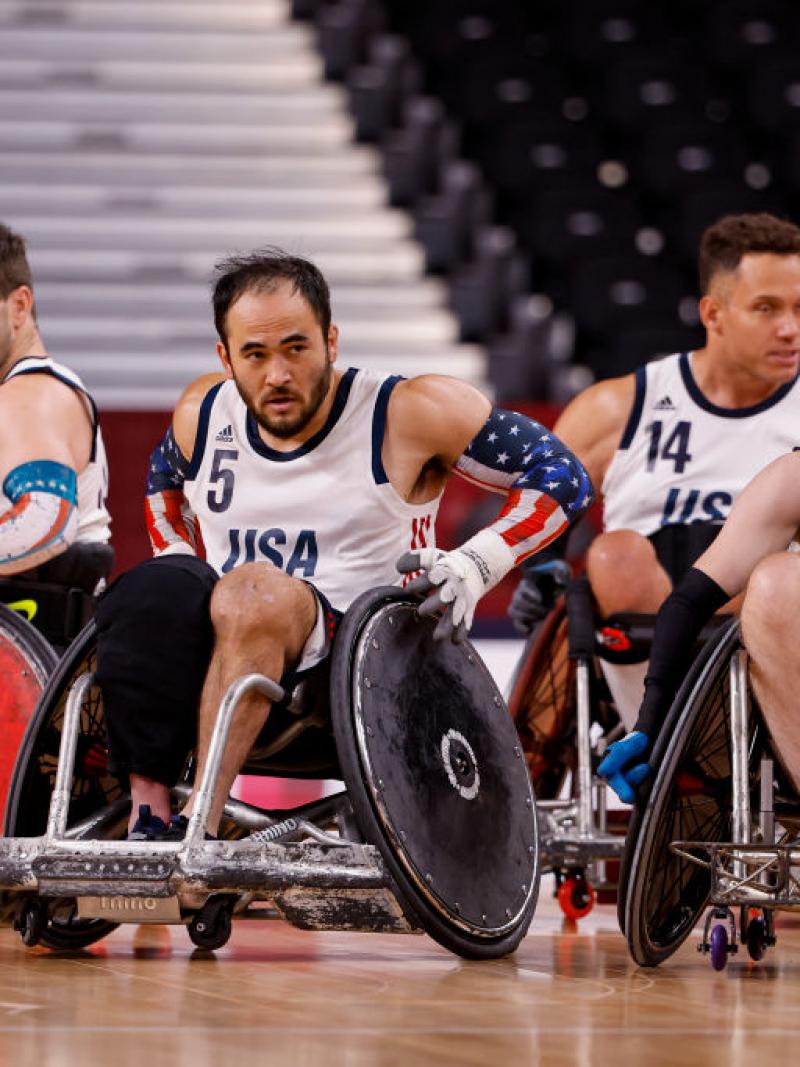 Four wheelchair rugby athletes in competition