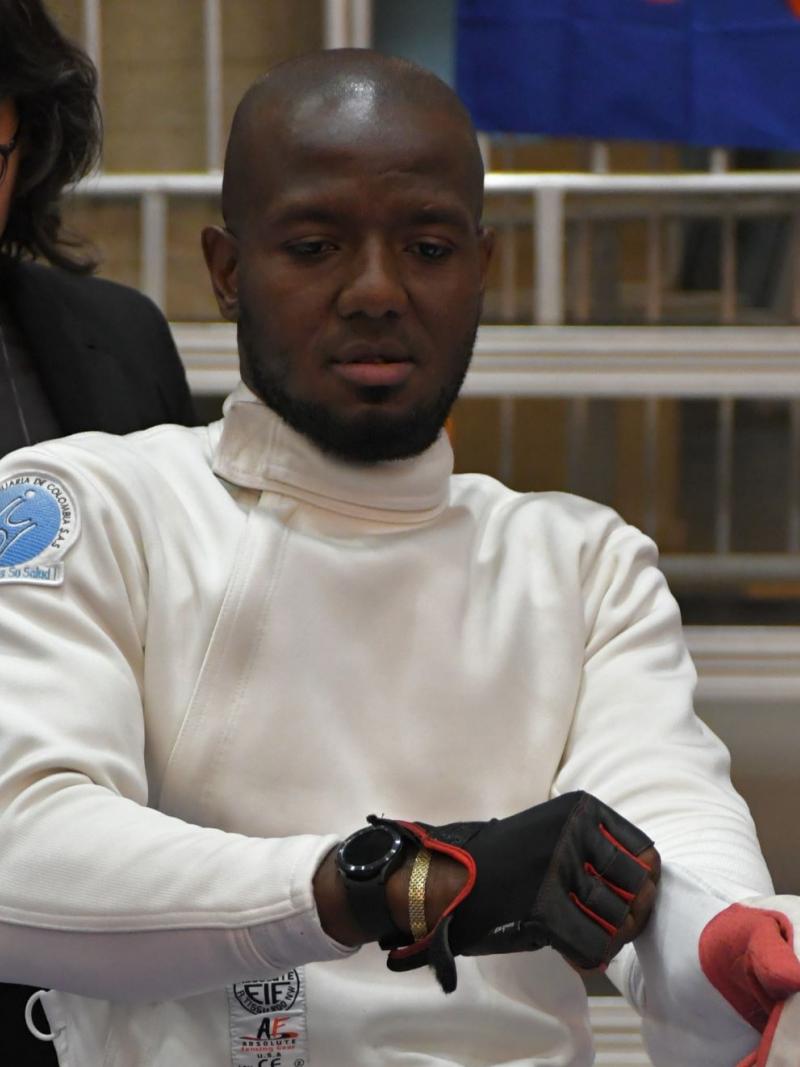 Amelio Castro Gruesso, a member of the Refugee Paralympic Team at Paris 2024, is wearing his wheelchair fencing gear