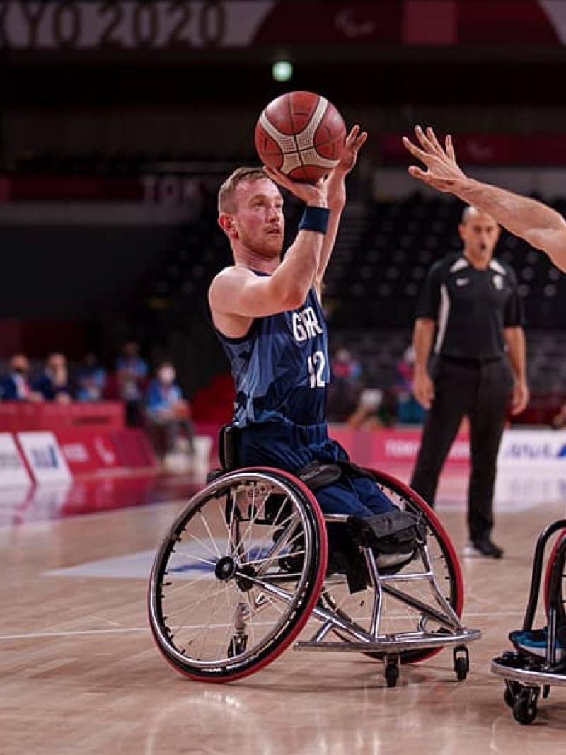 Wheelchair basketballer Gregg Warburton lines up a shot at the basket