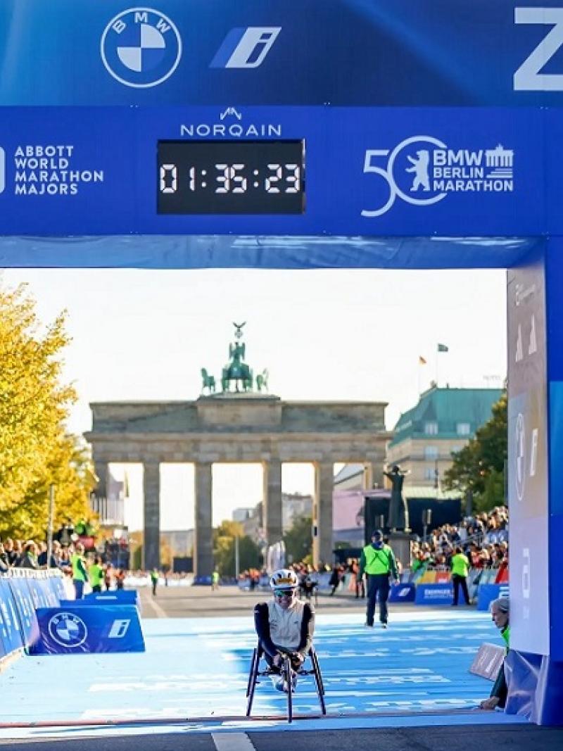 A wheelchair racer crossing the finish line of the Berlin Marathon