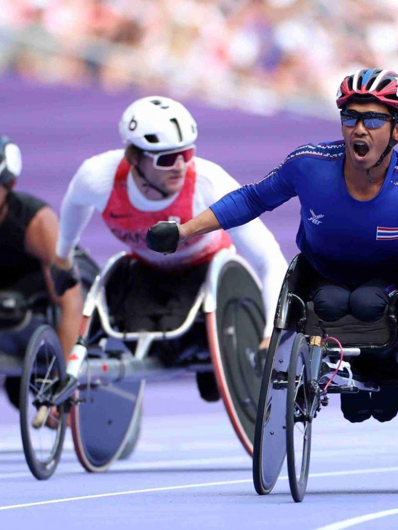 An athlete celebrate after winning the race