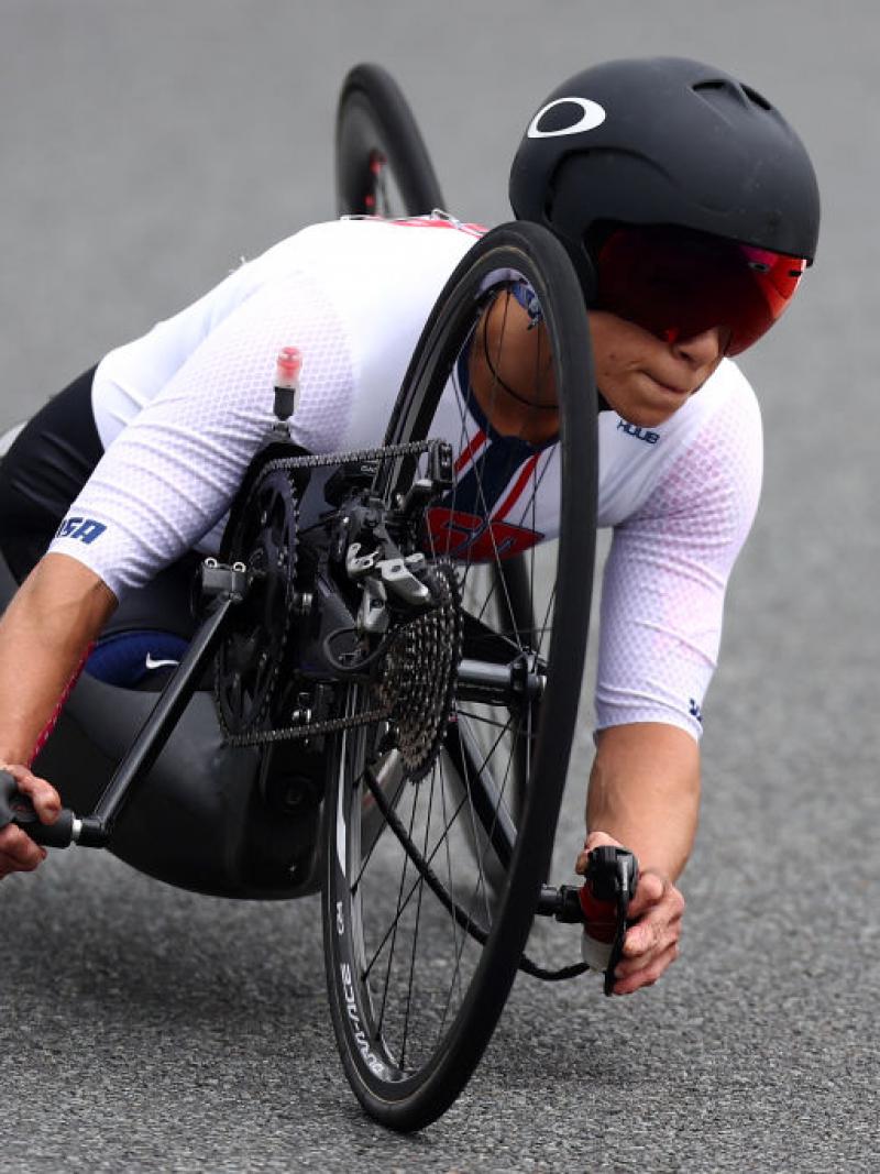 A woman races in a handcycle at Tokyo 2020