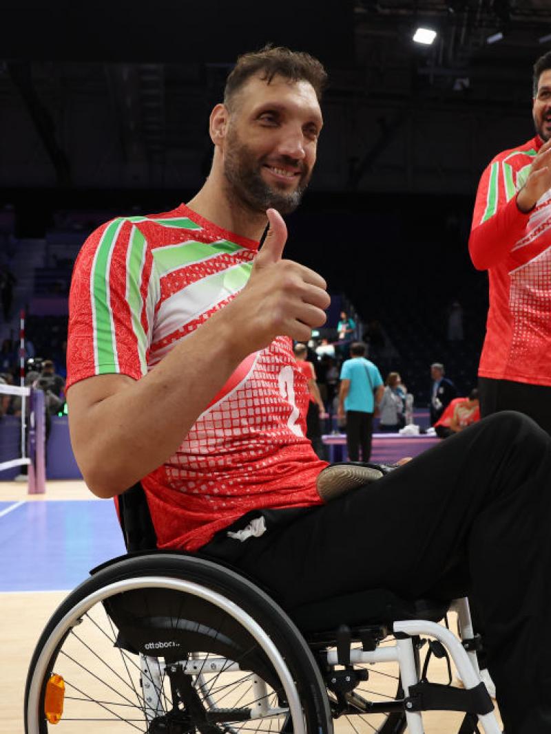 Morteza Mehrzadselakjani smiles and gives a thumbs up to the camera