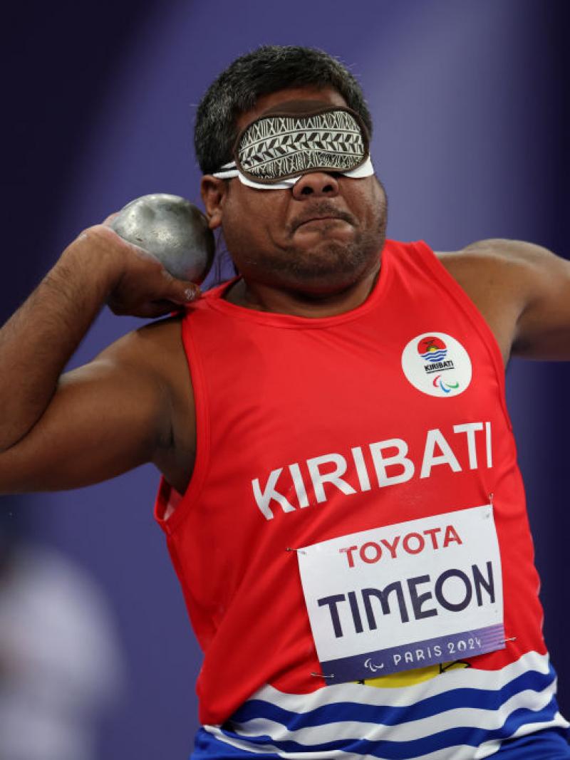 Blindfolded Para athlete Ongiou Timeon gets ready to throw a shot put