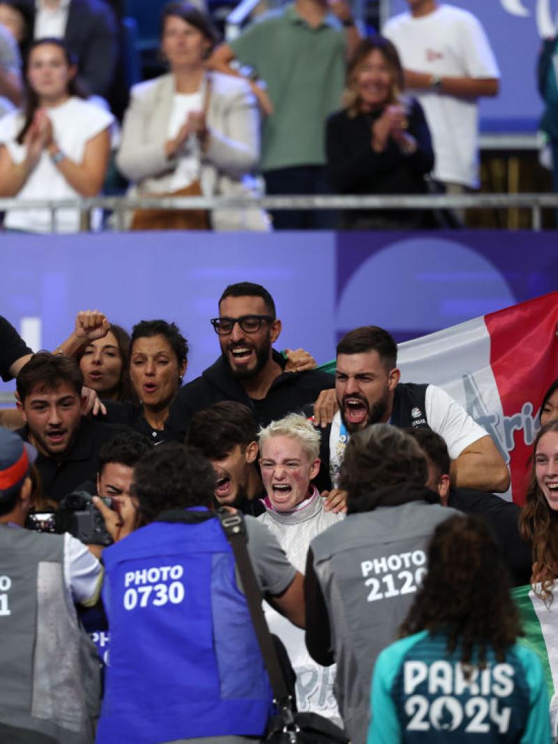 Bebe Vio cheering surrounded by fans and photographers