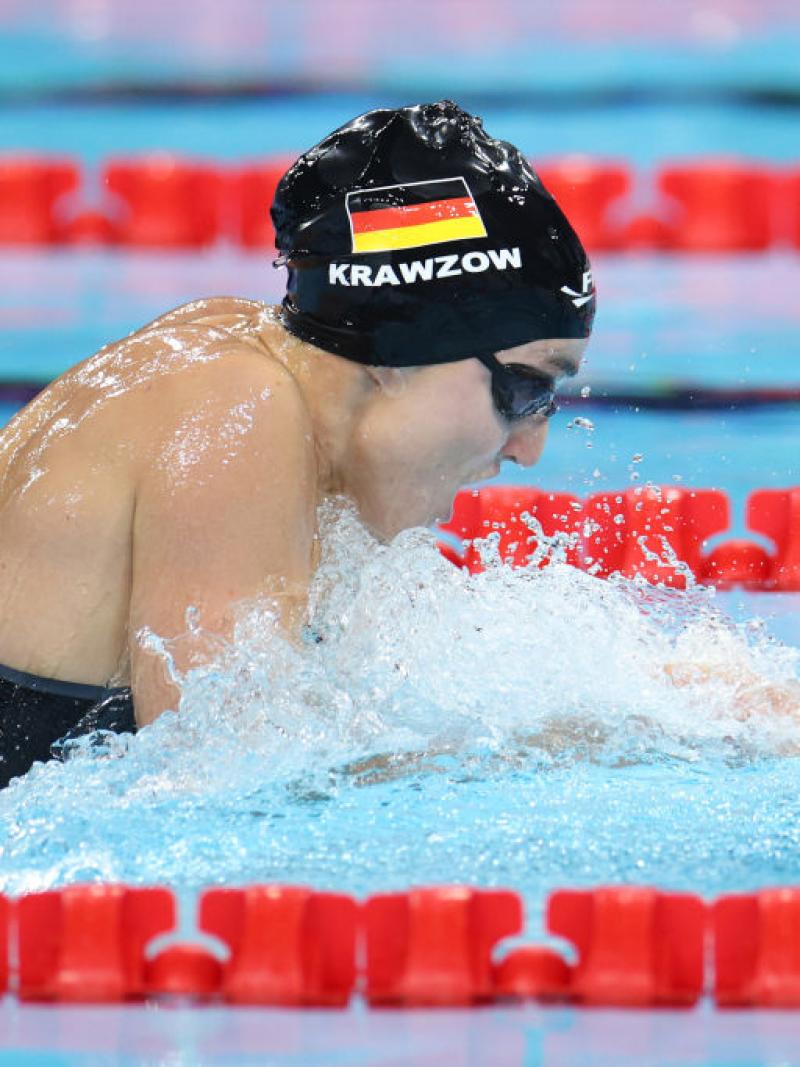 A female swimmer in a breaststroke race