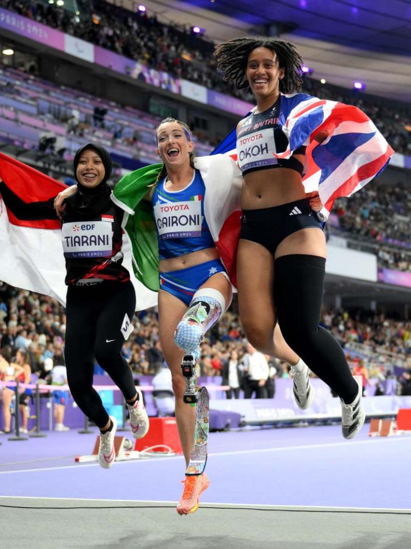 Athletes celebrate their medal
