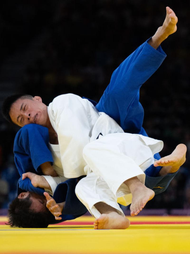Two judo athletes fighting in a bout