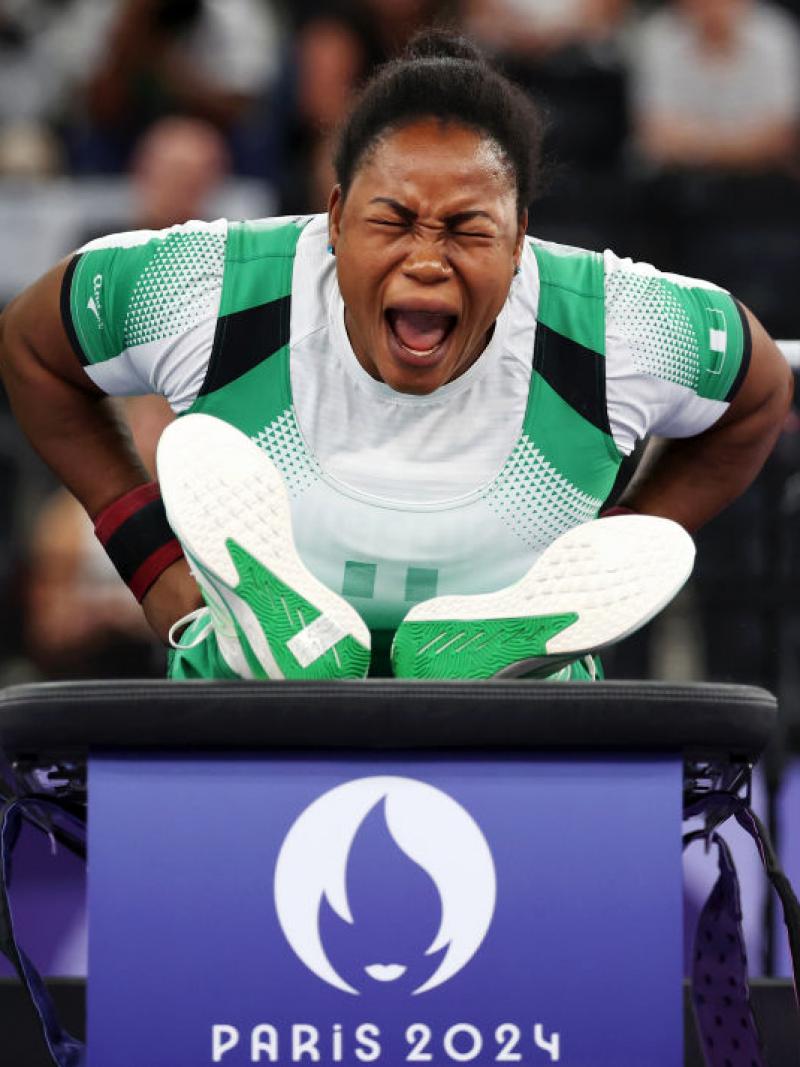 A female Para powerlifter reacts after her lift